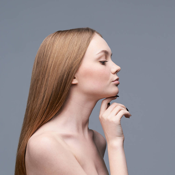 Young pretty woman studio portrait. Cosmetology concept - Foto, imagen