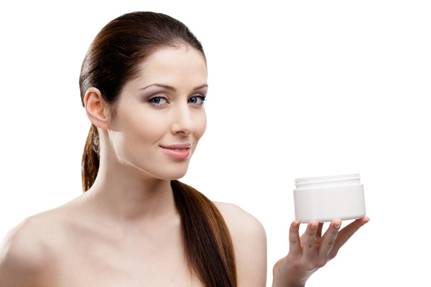 Woman handing the container with lifting cream - Foto, imagen