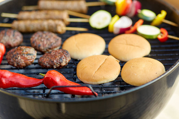 barbecue kebab meat and vegetables on grill - Photo, image
