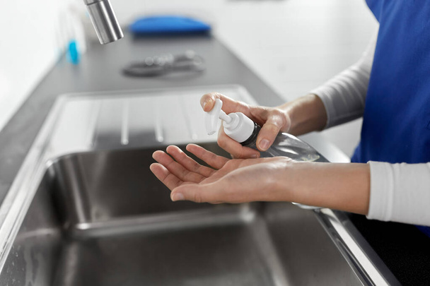 doctor or nurse washing hands with liquid soap - Фото, изображение