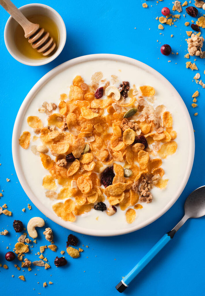 Muesli with yogurt. Healthy breakfast. Healthy lifestyle. Nutrition for children. Breakfast cereal. Top view. - Photo, Image