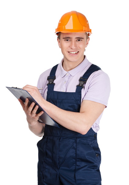 Contractor writing on a tablet - Photo, image