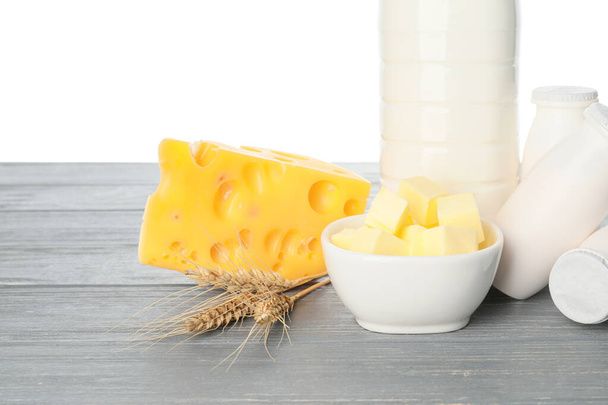 Different dairy products on table against white background - Foto, Bild