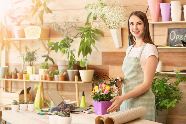 Portrait of female florist in shop - Photo, Image