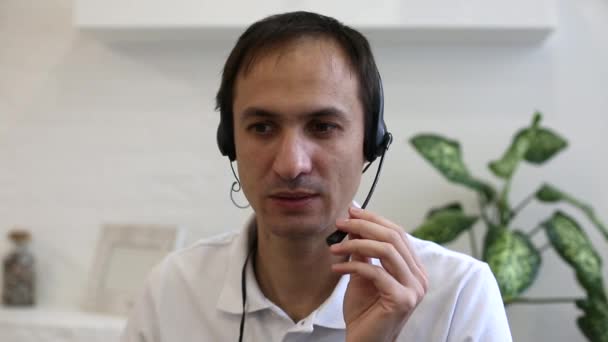 man having video call, wearing headphones  - Πλάνα, βίντεο