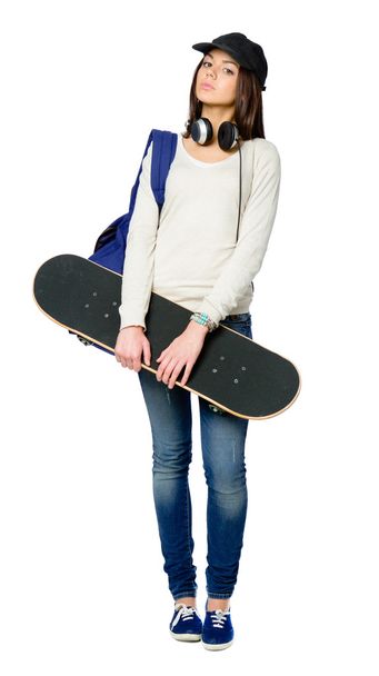 Full-length portrait of youngster with skateboard - Valokuva, kuva