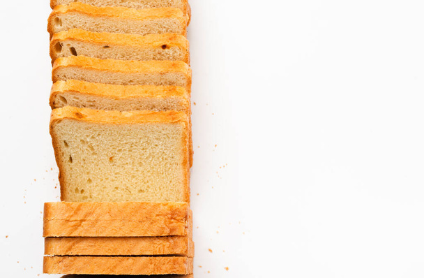 Sliced toast bread on a white background. Top view, flat lay - Fotografie, Obrázek