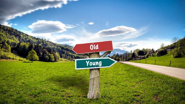 Ulica znak kierunku droga do młodych versus stary - Zdjęcie, obraz