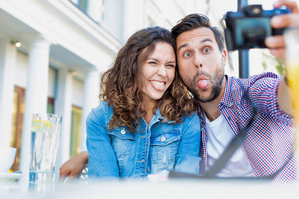Portrait of man taking selfie with his beautiful girlfriend - Photo, Image