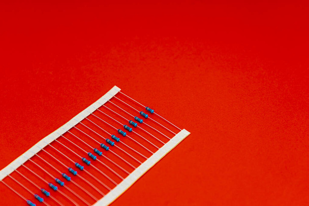 Electronic components for projects, resistors pack over red background - Fotoğraf, Görsel