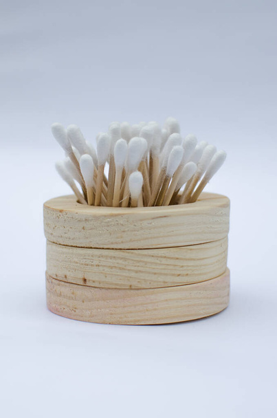 Wooden Ear Sticks on a white background. Ecological product is absolutely safe for healthy teeth and clean environment.Zero waste concept. Eco-friendly materials. - 写真・画像