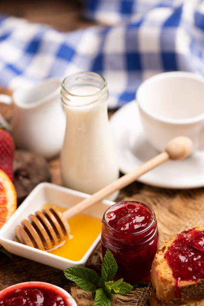 Breakfast with bred, honey strawberries jam close up - Фото, зображення