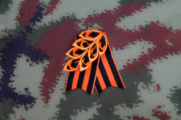 St. George ribbon in Russia is a symbol of military prowess and glory - Фото, зображення