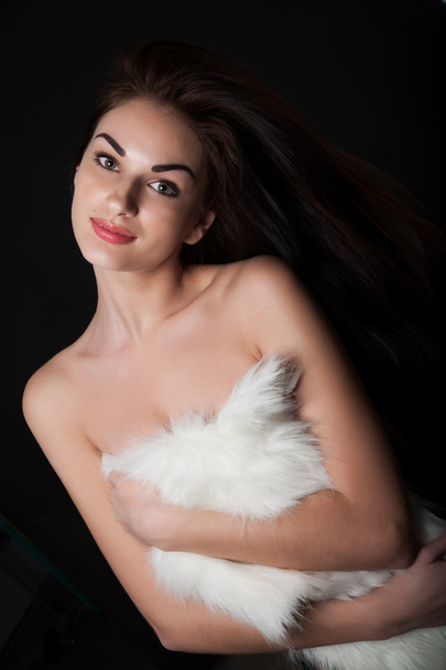 Girl covers her bare chest fur cape - Фото, зображення