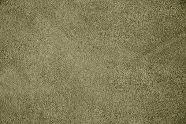 The texture of genuine suede. Green background.  - Photo, Image