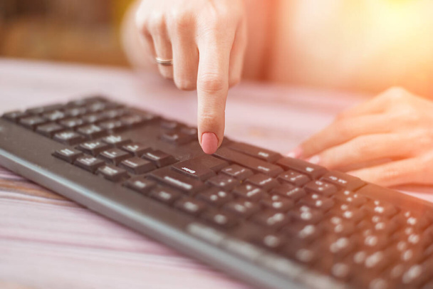 Woman presses the Enter key on the keyboard. - Photo, Image