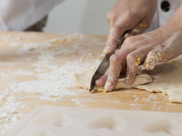 Asian chef preparing dough for pizza or bread on table, work lifestyle - Foto, Imagen