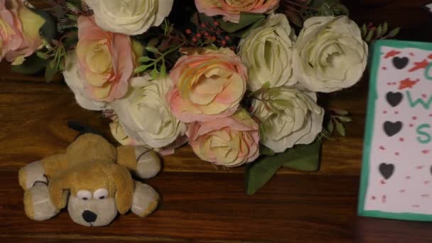 Get well soon card with nice flowers and small soft toy dog on the table. - Footage, Video
