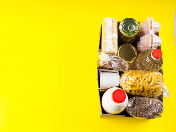Food staples delivery or donation box concept - Photo, Image
