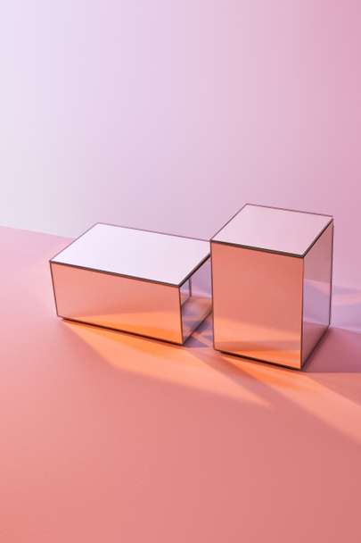 cubes with light reflection on surface on pink background - Fotoğraf, Görsel