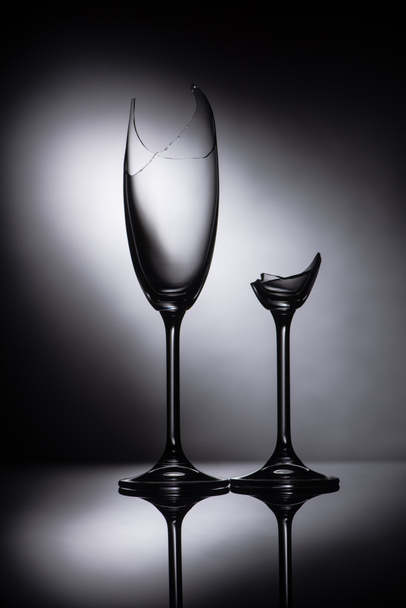 broken sharp transparent glasses in dark - Foto, Imagen