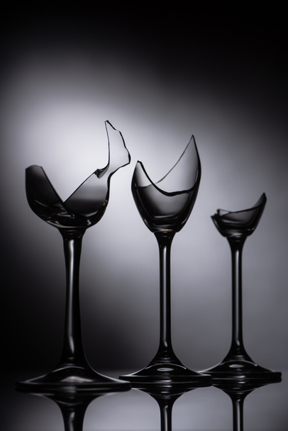 broken sharp transparent glasses in dark - Foto, Imagen