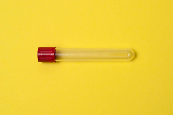 One blood collection tube on yellow background - Photo, image