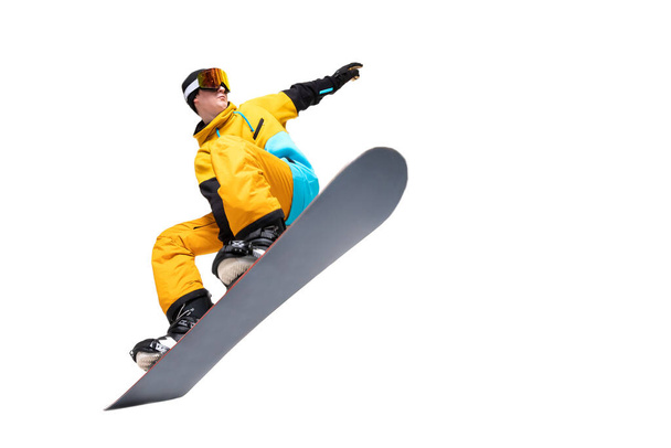 Portrét mladý muž snowboardista skok pohyb na snowboardu izolované bílé pozadí - Fotografie, Obrázek