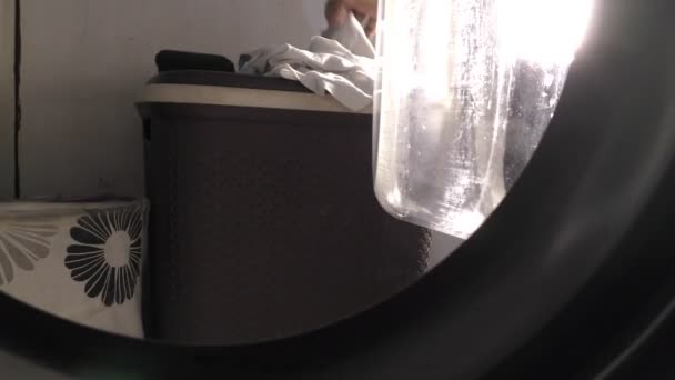 Putting Clothes in washing machine - Footage, Video