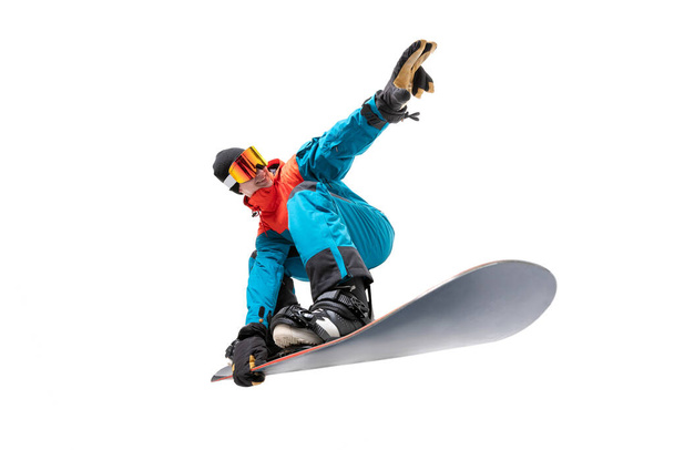 Portrait young man snowboarder jump move on snowboard isolated white background - Fotó, kép