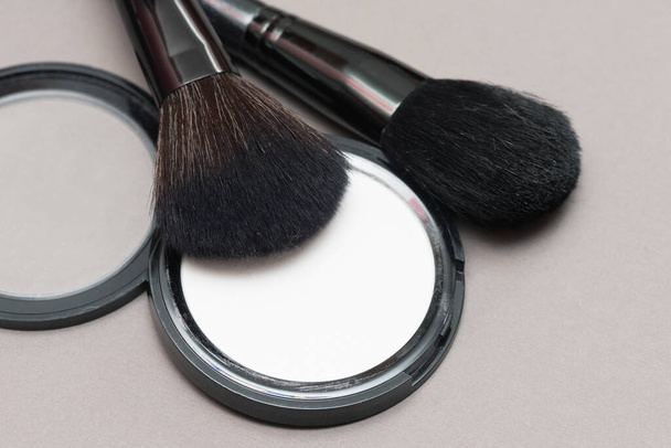 Face powder and make up brushes close up. - Photo, Image