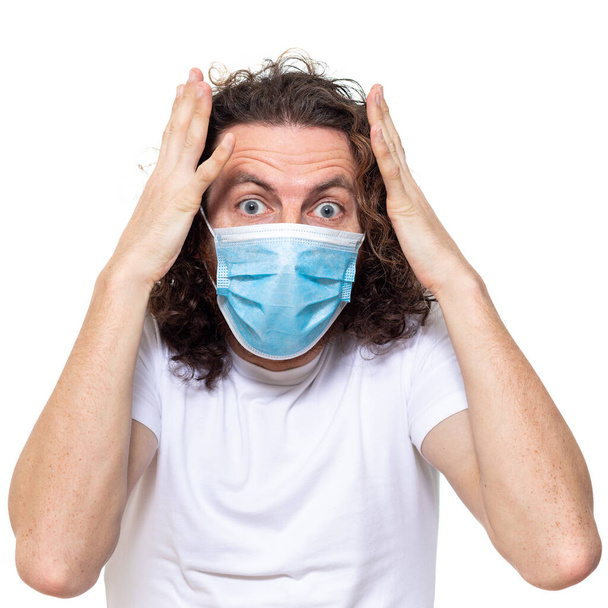 Man in medical mask. Pandemic coronavirus epidemic covid-19 - Photo, Image