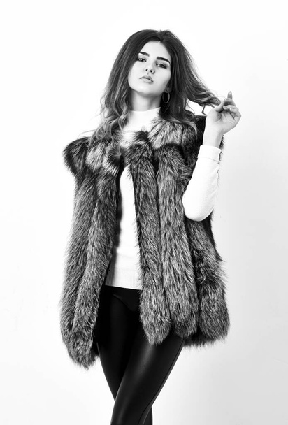 Fashion trend concept. Winter fashionable wardrobe for female. Boutiques selling fur. Woman makeup face wear fur vest white background. Silver fur vest fashion clothing. Luxury fur accessory clothes - Photo, image