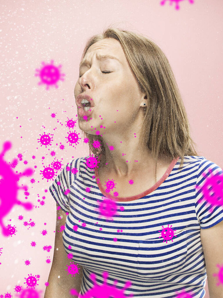 Caucasian woman sneezing, illustration of virus spreading, stop epidemic of coronavirus - Фото, изображение