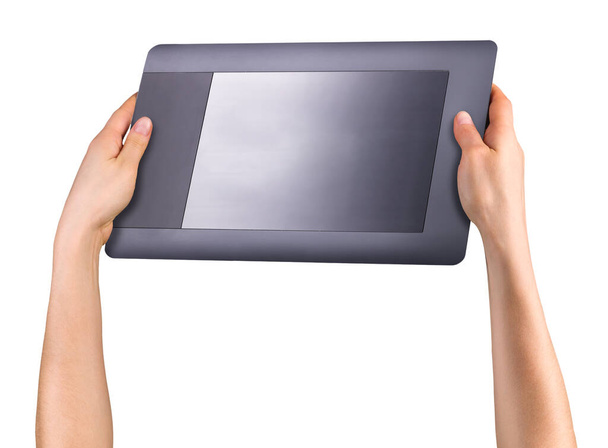 Hand holding graphic tablet for illustrators, designers and photographers isolated on white background with clipping path - Photo, Image