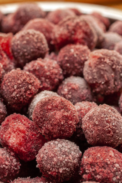 Frozen cherry fruit close up. Cherry in ice crystals. - Photo, image