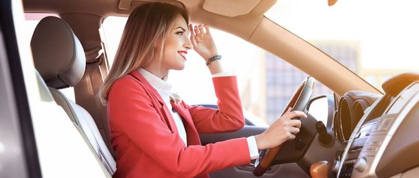 Happy young woman driving modern car on sunny day. Banner design - Photo, Image
