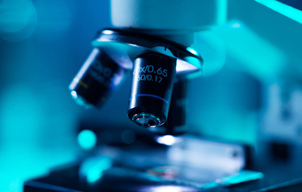 Close-up of scientific microscope. Laboratory in hospital. Epidemic disease, healthcare, vaccine research and coronavirus 2019-ncov test concept. - Zdjęcie, obraz
