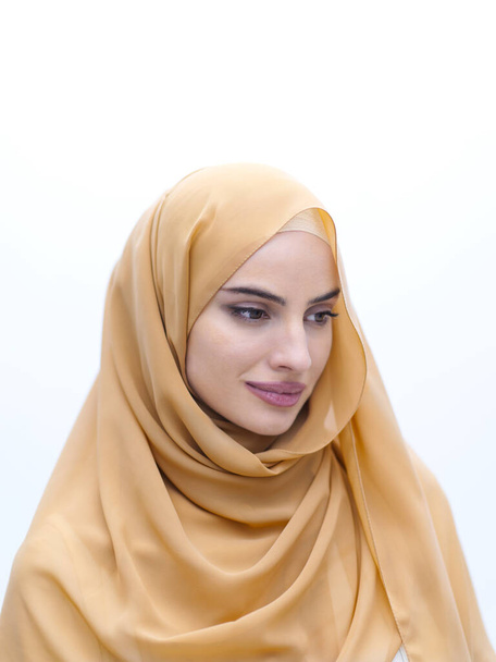 portrait of beautiful muslim woman in fashionable dress with hijab isolated on white background representing modern islam fashion and ramadan kareem concept - Zdjęcie, obraz