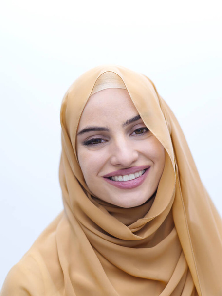 portrait of beautiful muslim woman in fashionable dress with hijab isolated on white background representing modern islam fashion and ramadan kareem concept - Фото, зображення