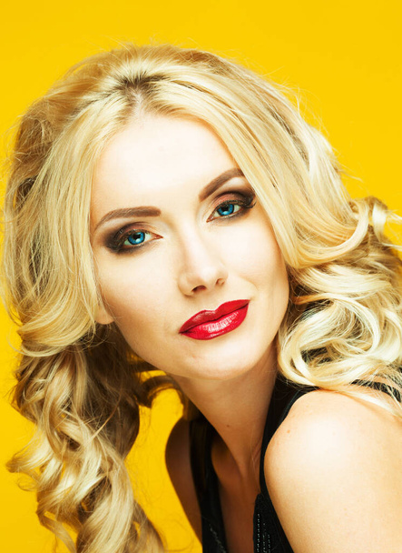Charming woman with curly blond hair, attractive look and sensual lips, fashion model - 写真・画像