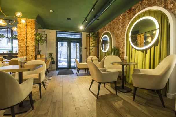 Light modern interior of urban restaurant or cafe with dining places - Fotografie, Obrázek