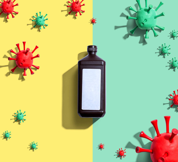 Alcohol bottle with viral epidemic influenza theme - Фото, изображение