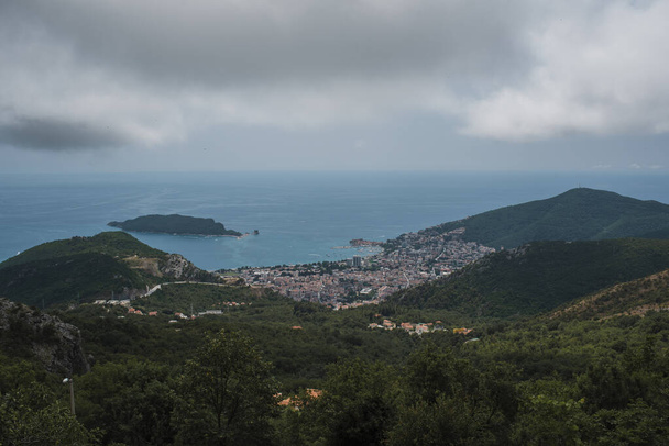 drone view of montenegro, a village between mountains, nature, sea and sky. Cloudy day. - Photo, Image