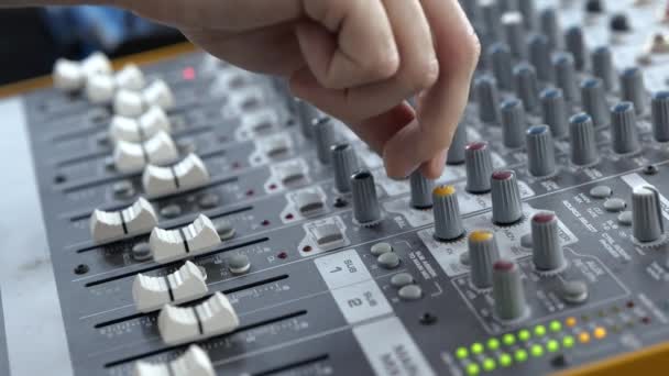 Young man in sound recording studio. Close up and cut view slow motion. Working with mixing music console equipment. - Footage, Video