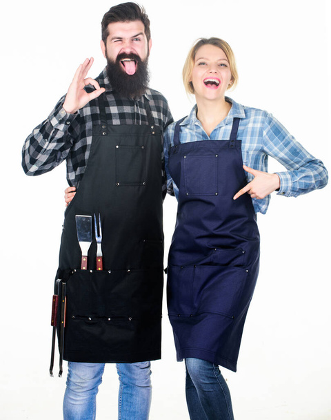 Tools for roasting meat. Couple in love hold kitchen utensils. Man bearded hipster and girl. Preparation and culinary. Picnic barbecue. food cooking recipe. Family weekend. So yummy - Фото, изображение