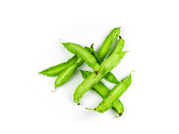 Winged beans on white background isolate. Vegetables to eat with chili paste. Green vegetables - Photo, Image