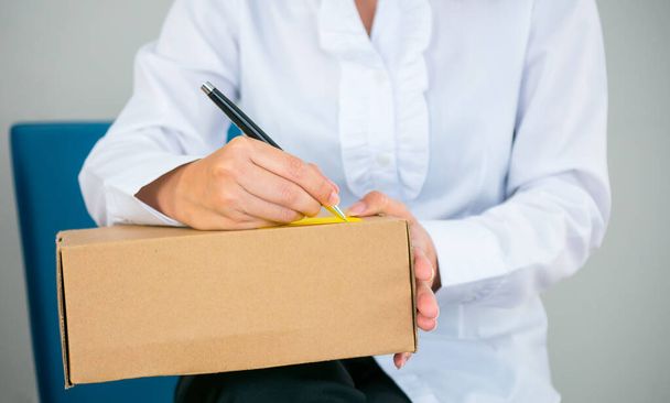 Start up owner small business with many parcel package are Writing customer Address before shipping with Check list paper at work place online Koncepcja sprzedaży - Zdjęcie, obraz