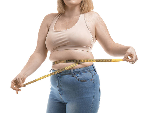 Overweight woman with measuring tape on white background. Weight loss concept - Foto, Imagen