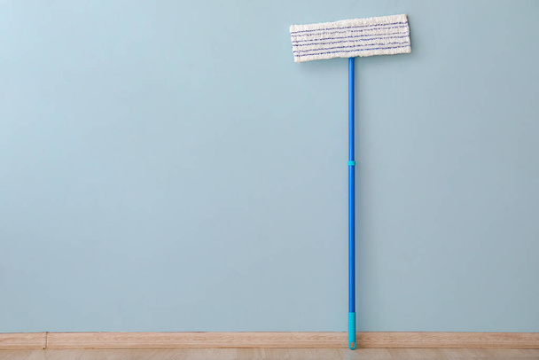 Floor mop near color wall - Photo, Image